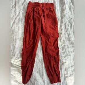 Burnt orange colored lululemon dance studio joggers